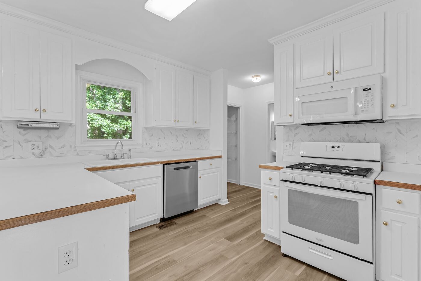 White kitchen with gas range